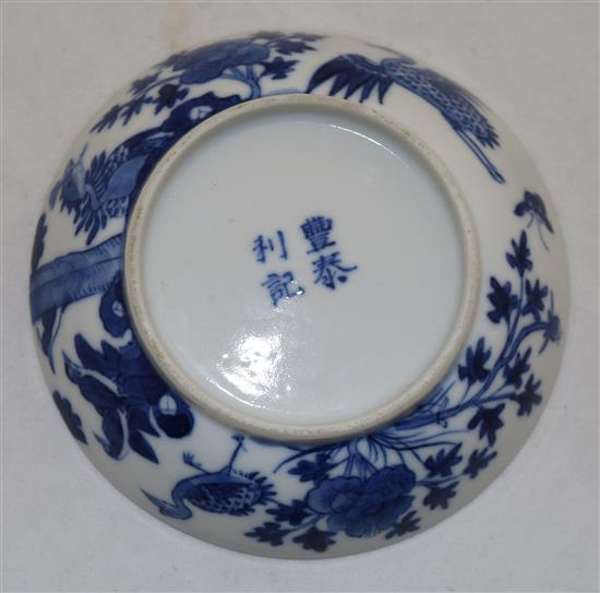 A Chinese blue and white phoenix and peony saucer dish, 19th century, 10.3cm